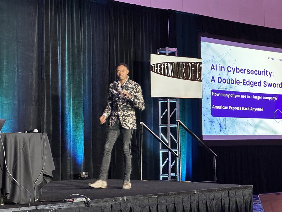 Corey White presenting AI in Cybersecurity: A Double-Edged Sword